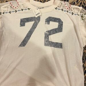 Free people long sleeve t shirt.  Ivory w/blue, red and green colors etc. NWT